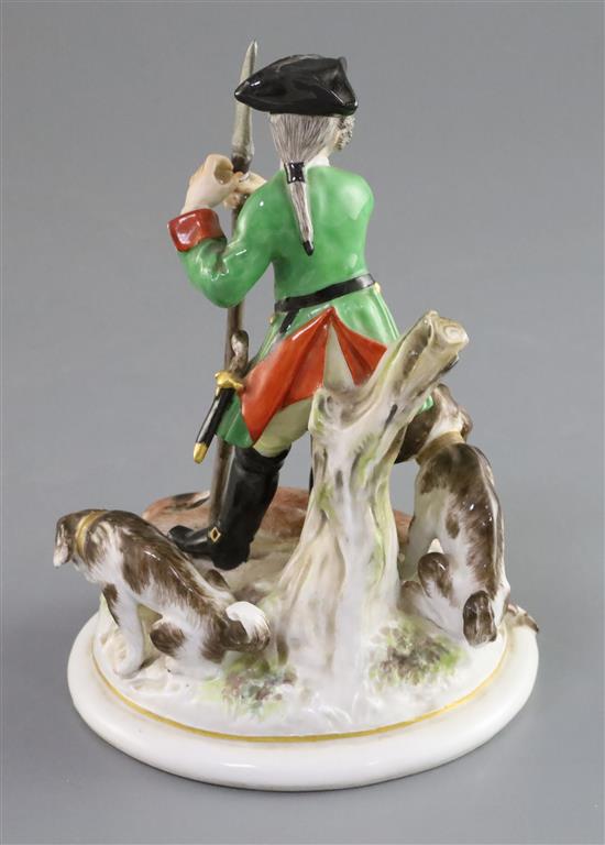 A Meissen group of a huntsman with hounds and prey, 19th century, H. 15.5cm, spear tip restored